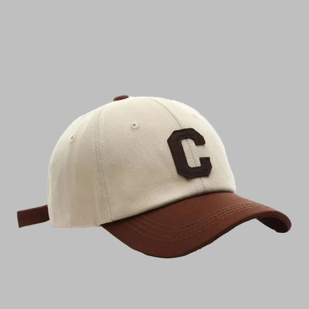 Beige and brown cap with a letter 'C' on a white background